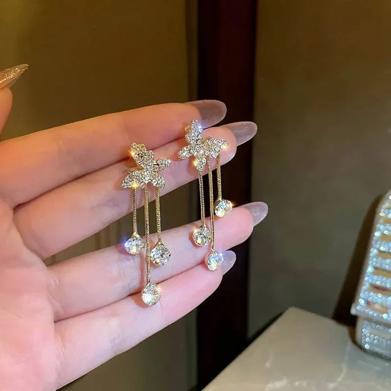 Silver butterfly rhinestone drop dangle earrings with pearl tassel chain and heart elements on alloy