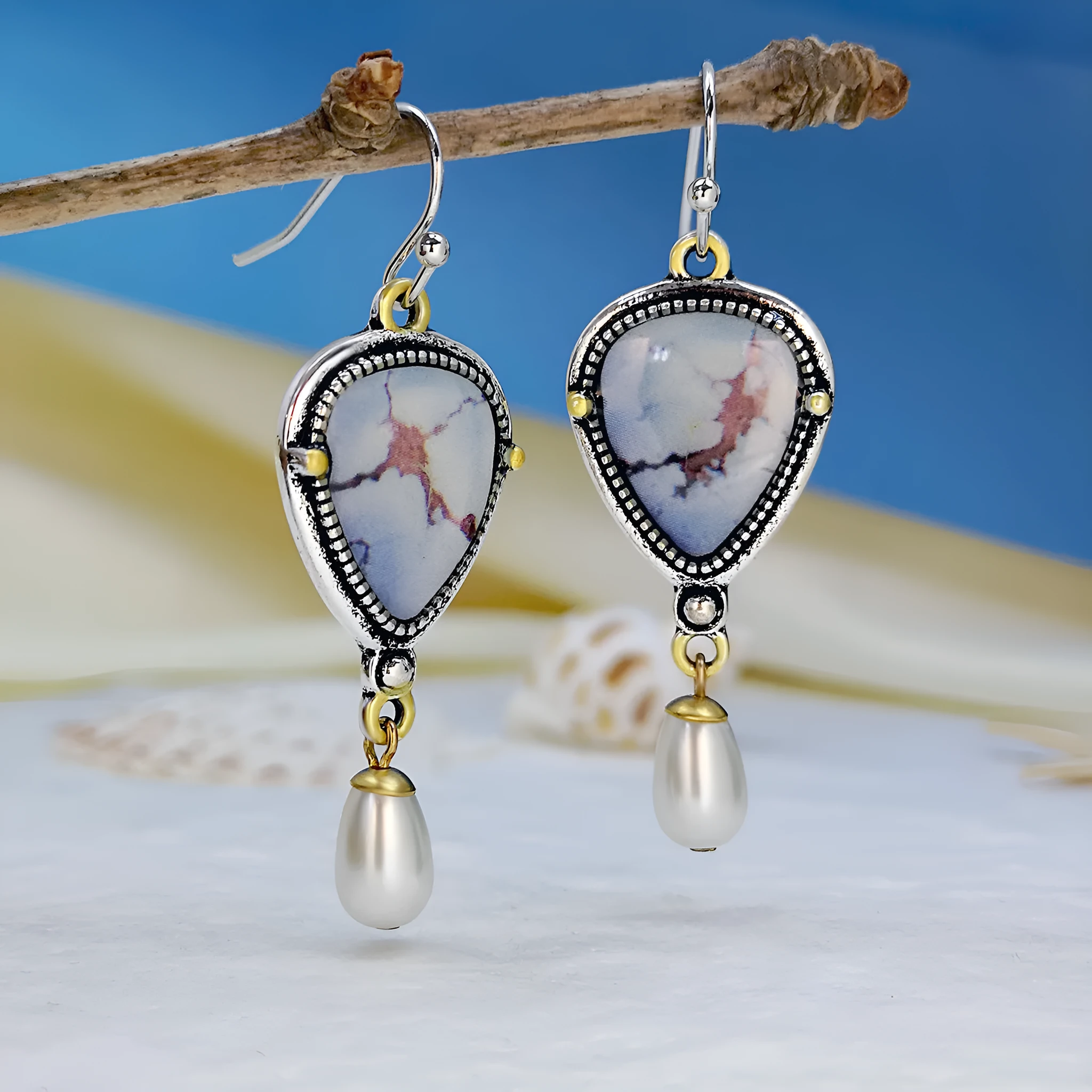 Retro blue geometric drop earrings with synthetic opal and pearl accents on electroplated metal