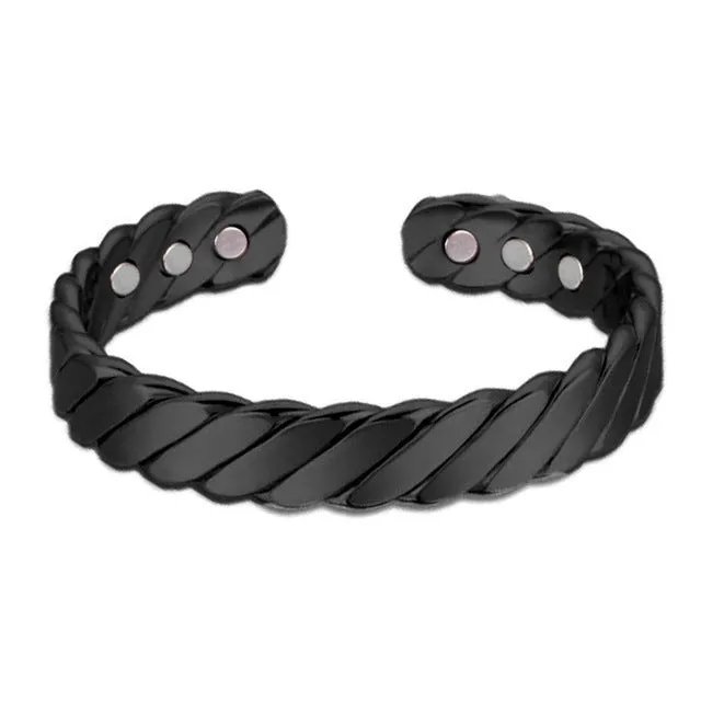 Silver tone metal bracelet on a flat surface, unisex design for men women children