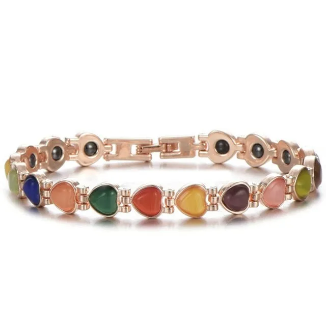Silver tone metal bracelet on a flat surface, unisex design for men women children