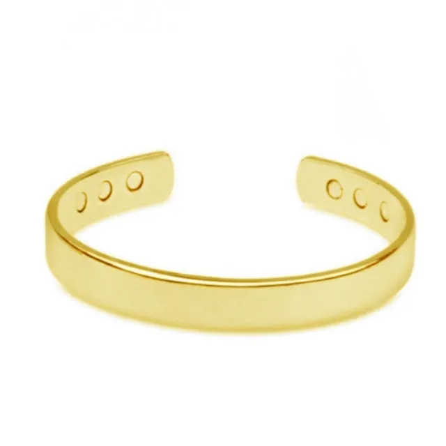 Silver tone metal bracelet on a flat surface, unisex design for men women children