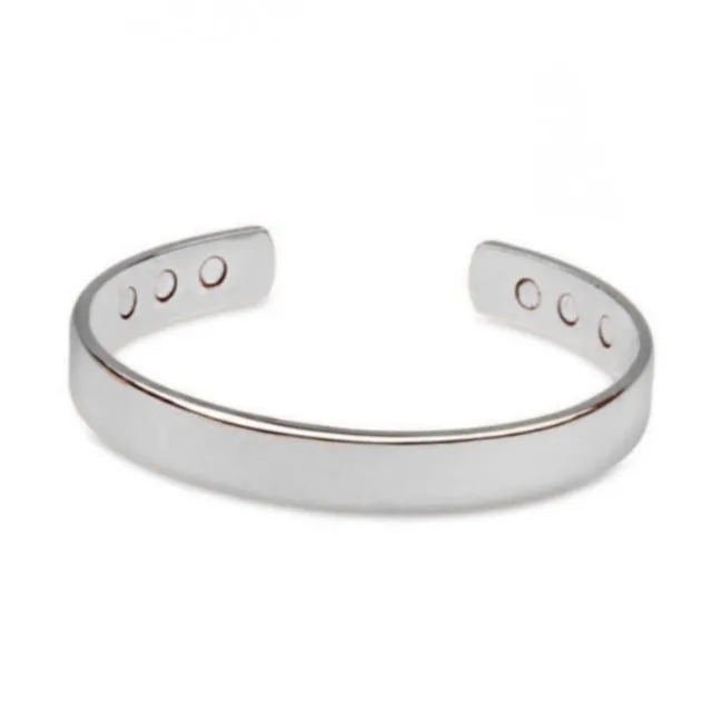 Silver tone metal bracelet on a flat surface, unisex design for men women children