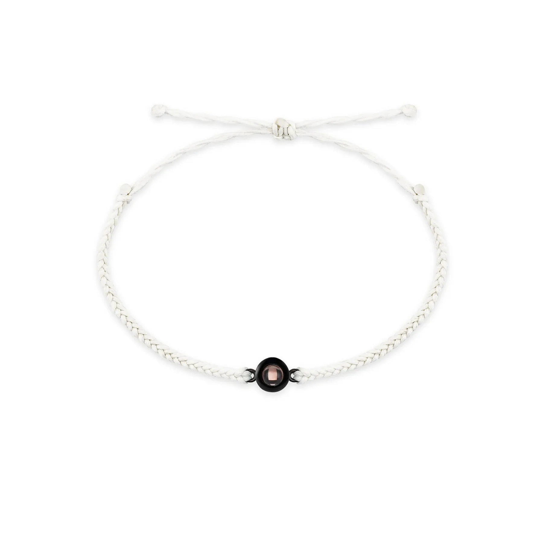 Personalised photo projection bracelet in copper with gold rope, showing unisex geometric shape