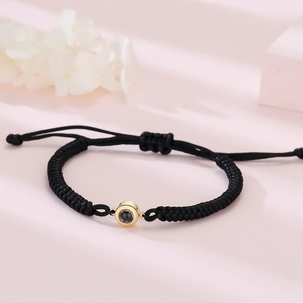 Personalised photo projection bracelet in copper with gold rope, showing unisex geometric shape