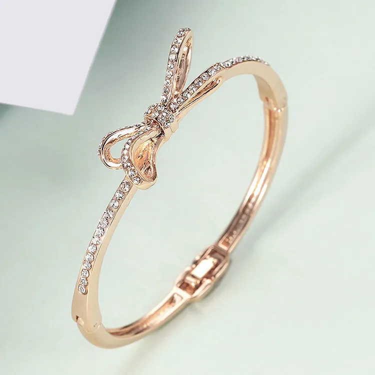 Rose gold electroplated copper women's bracelet with bow and diamond accents