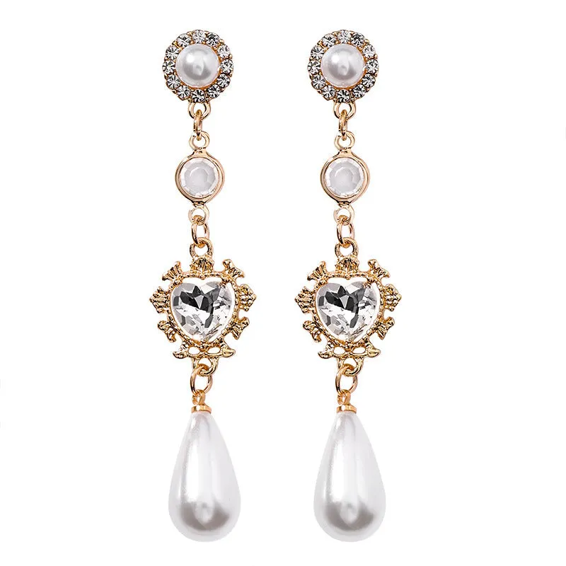 Gold pearl drop earrings with heart-shaped alloy frame and single pearl pendant on gold-tone finish