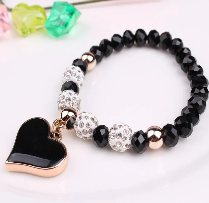 Elastic crystal bracelet and bangle heart bracelet in pink colour on white background