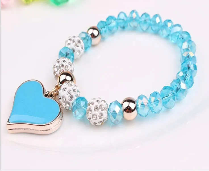 Elastic crystal bracelet and bangle heart bracelet in pink colour on white background