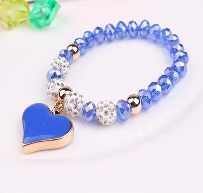 Elastic crystal bracelet and bangle heart bracelet in pink colour on white background