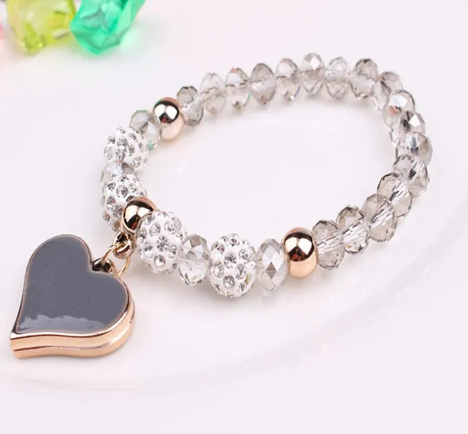 Elastic crystal bracelet and bangle heart bracelet in pink colour on white background