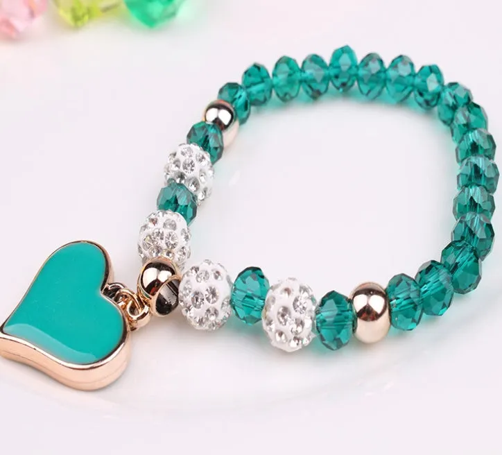 Elastic crystal bracelet and bangle heart bracelet in pink colour on white background