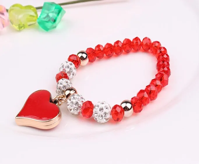 Elastic crystal bracelet and bangle heart bracelet in pink colour on white background