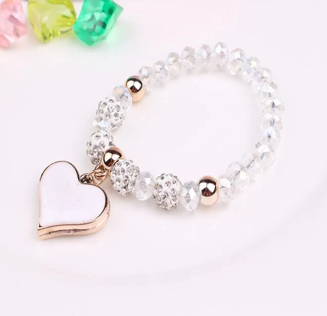 Elastic crystal bracelet and bangle heart bracelet in pink colour on white background