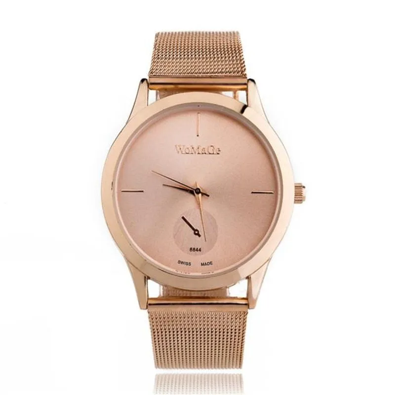 Unisex alloy mesh quartz watch with round silver case and dial on wrist
