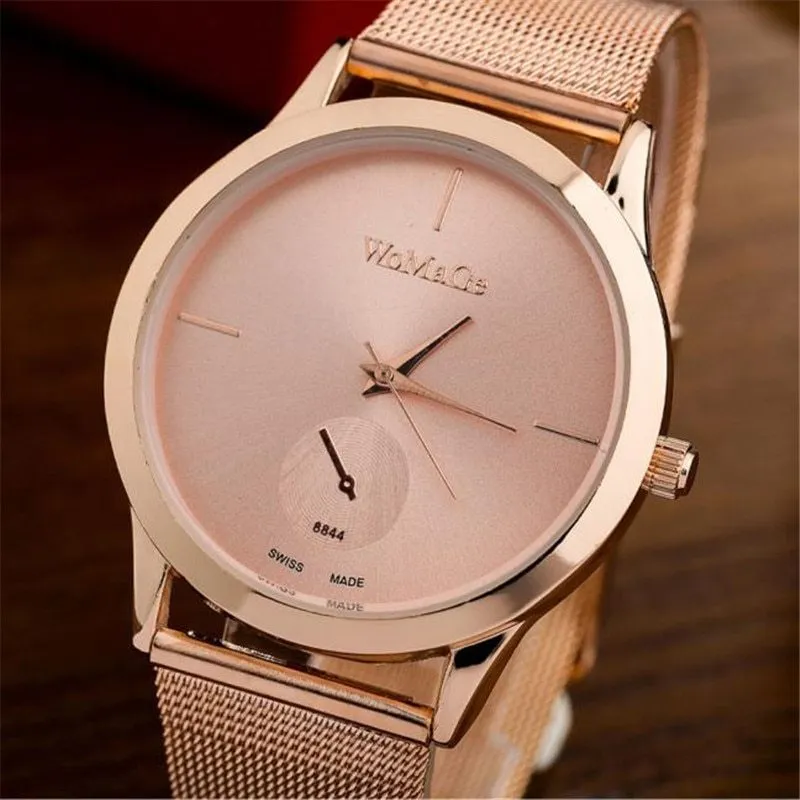 Unisex alloy mesh quartz watch with round silver case and dial on wrist