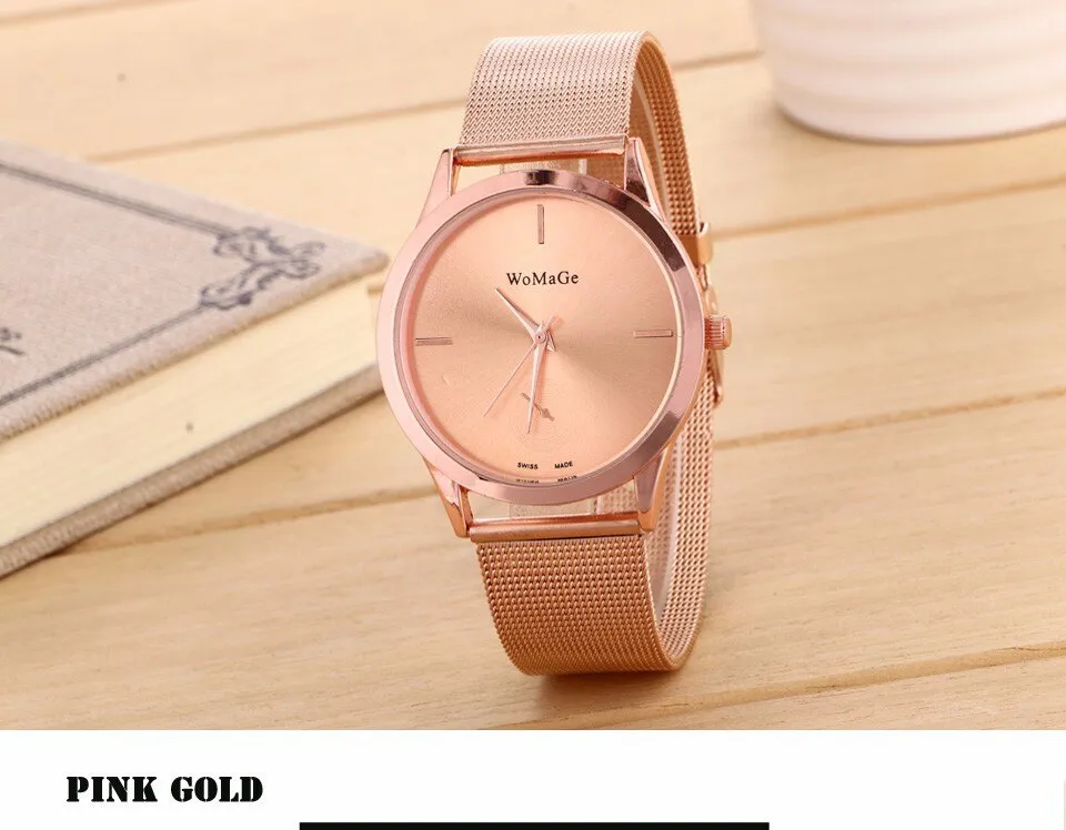 Unisex alloy mesh quartz watch with round silver case and dial on wrist