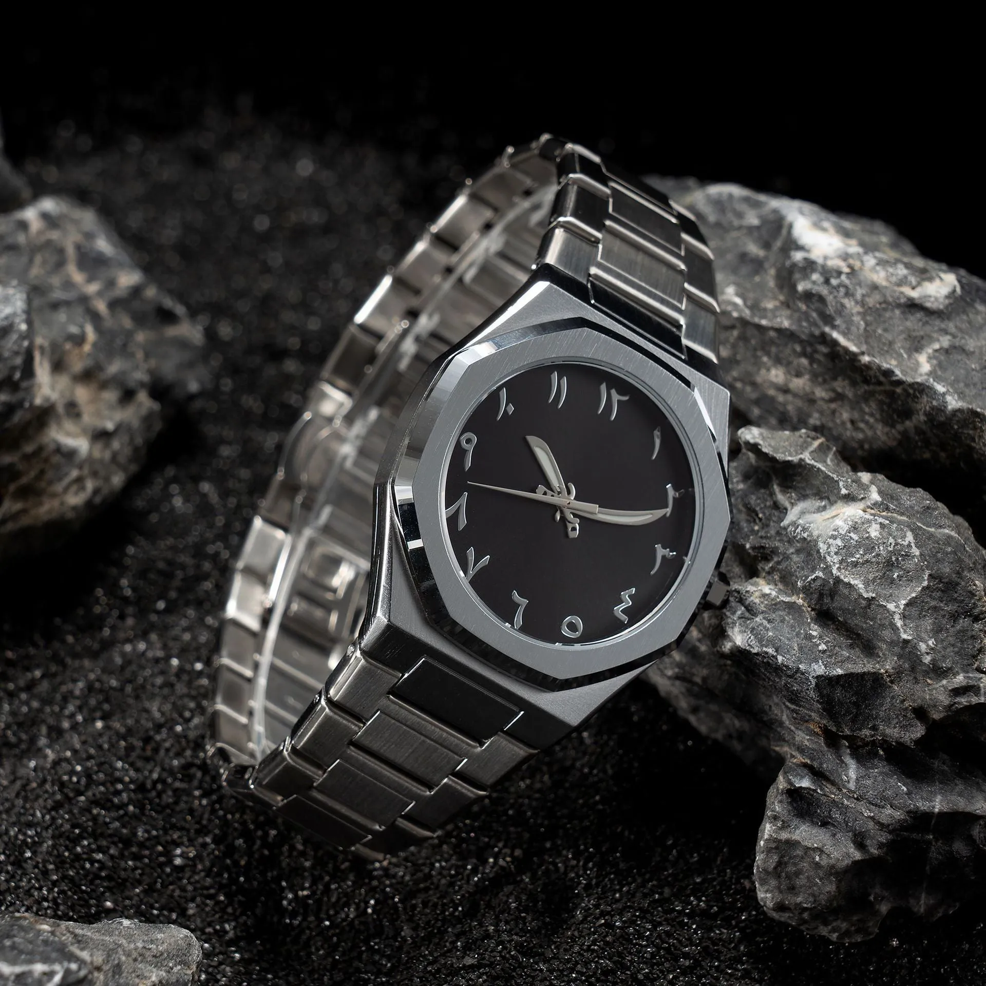 Men's business casual watch with stainless steel band and black dial on wrist