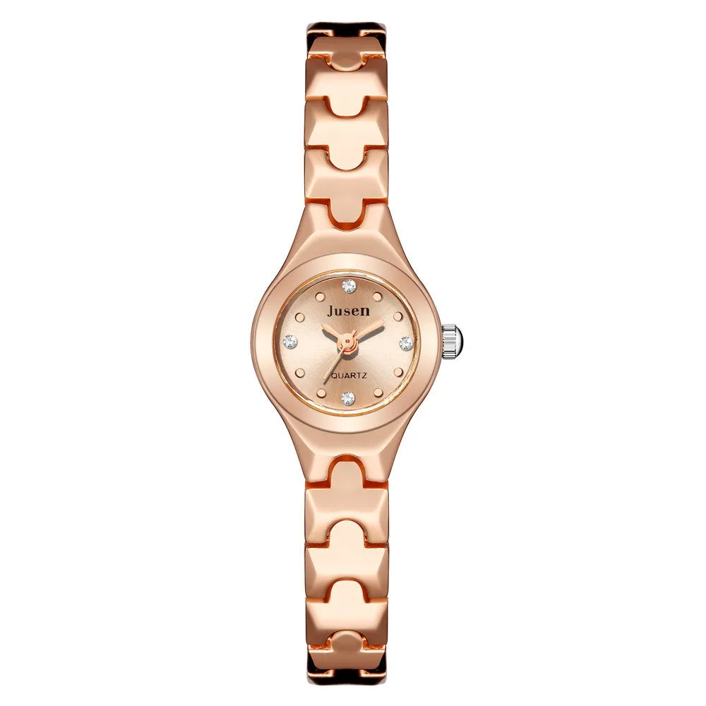 Small round ladies quartz watch with alloy bracelet and gold-tone finish on white background