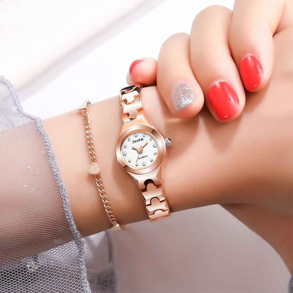 Small round ladies quartz watch with alloy bracelet and gold-tone finish on white background