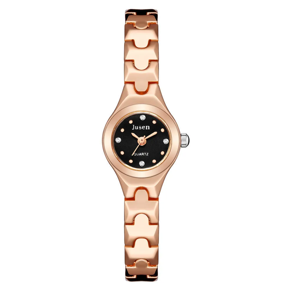 Small round ladies quartz watch with alloy bracelet and gold-tone finish on white background
