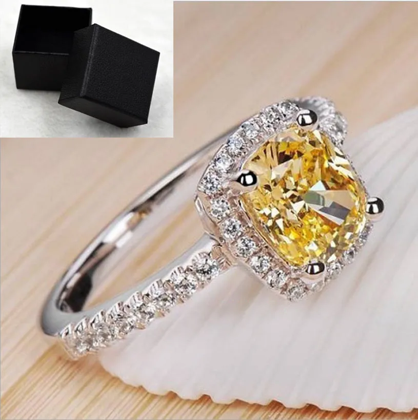 Silver alloy ring with artificial gemstone geometric inlay on white background