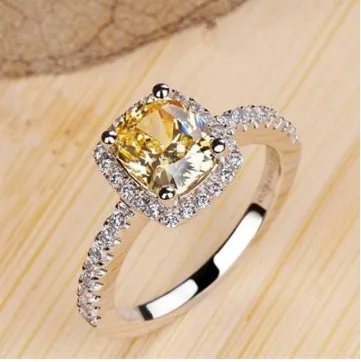 Silver alloy ring with artificial gemstone geometric inlay on white background