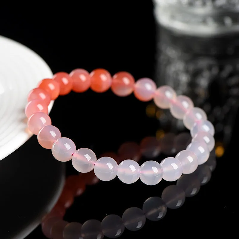 Natural gradient salt source colour Yanyuan agate bracelet with geometric beads on a wrist.