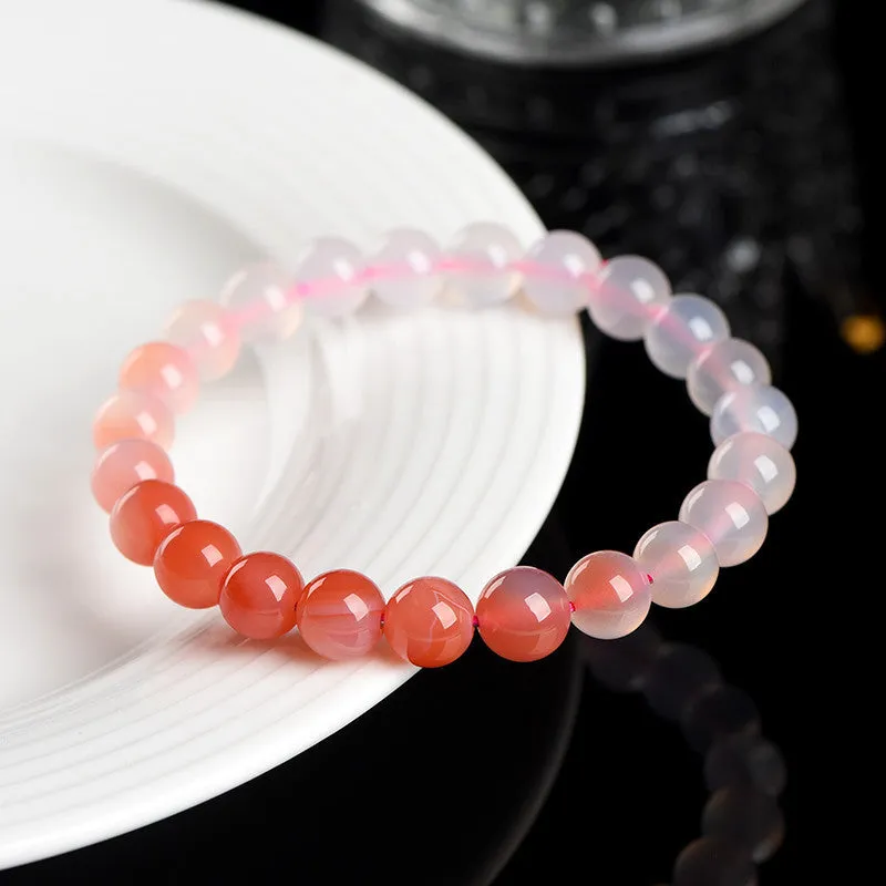 Natural gradient salt source colour Yanyuan agate bracelet with geometric beads on a wrist.