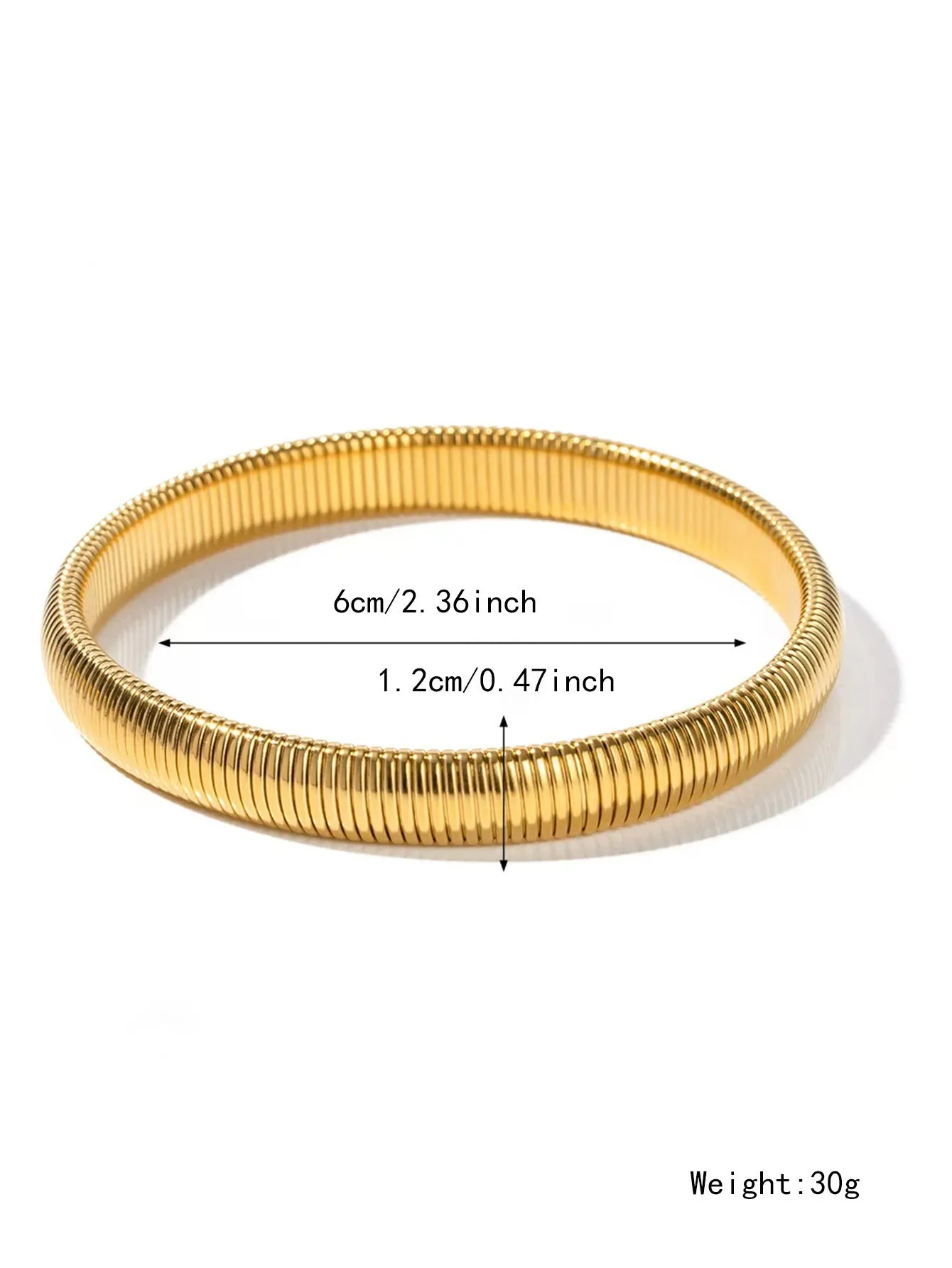 Gold women's elastic bracelet with a wide vertical stripe pattern, shown on a wrist.