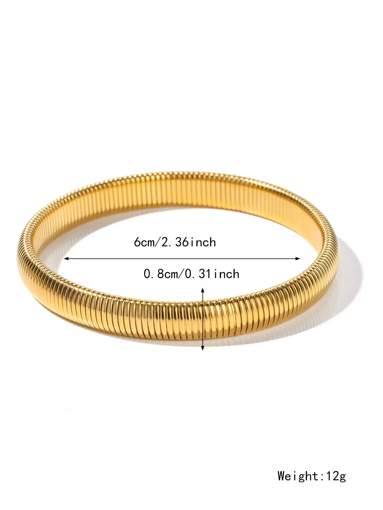 Gold women's elastic bracelet with a wide vertical stripe pattern, shown on a wrist.