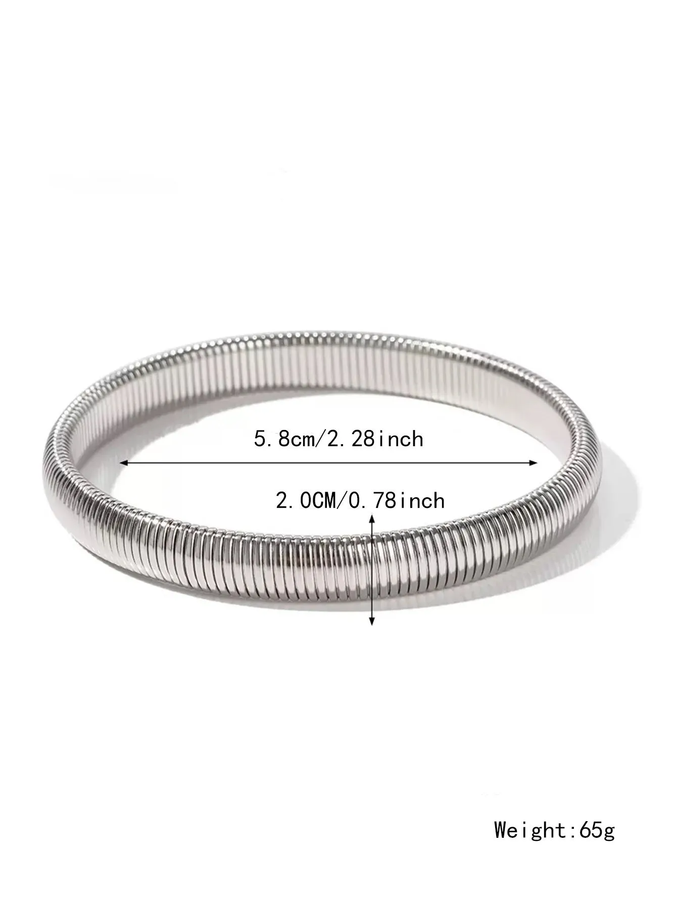 Gold women's elastic bracelet with a wide vertical stripe pattern, shown on a wrist.