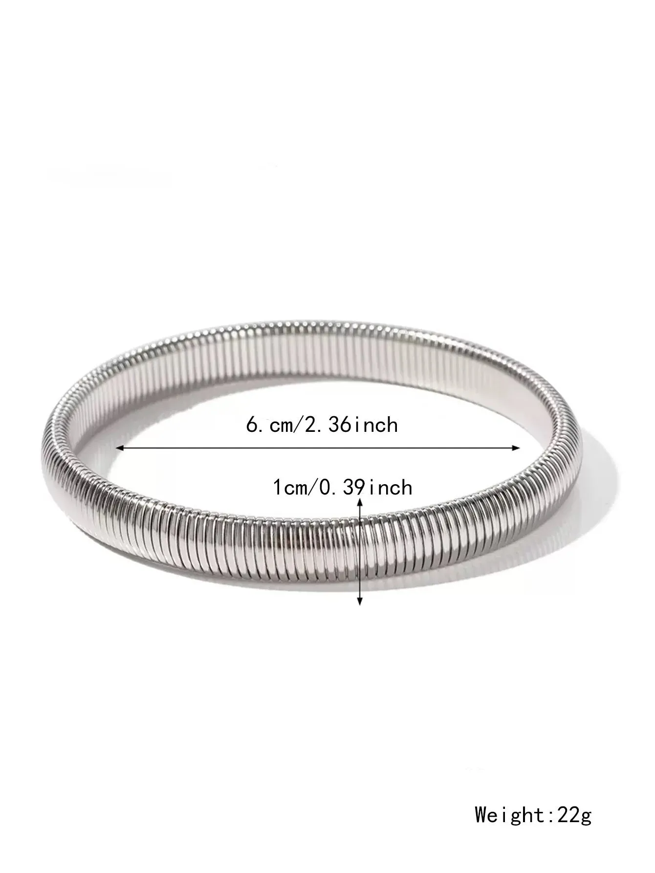 Gold women's elastic bracelet with a wide vertical stripe pattern, shown on a wrist.