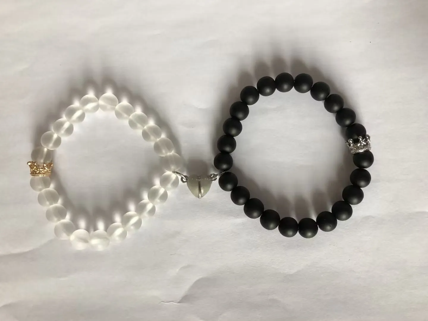 2pcs handmade glow-in-the-dark crown beaded bracelets in white and black with glass beads and luminous heart charm