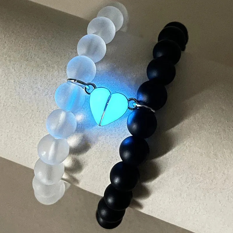 2pcs handmade glow-in-the-dark crown beaded bracelets in white and black with glass beads and luminous heart charm