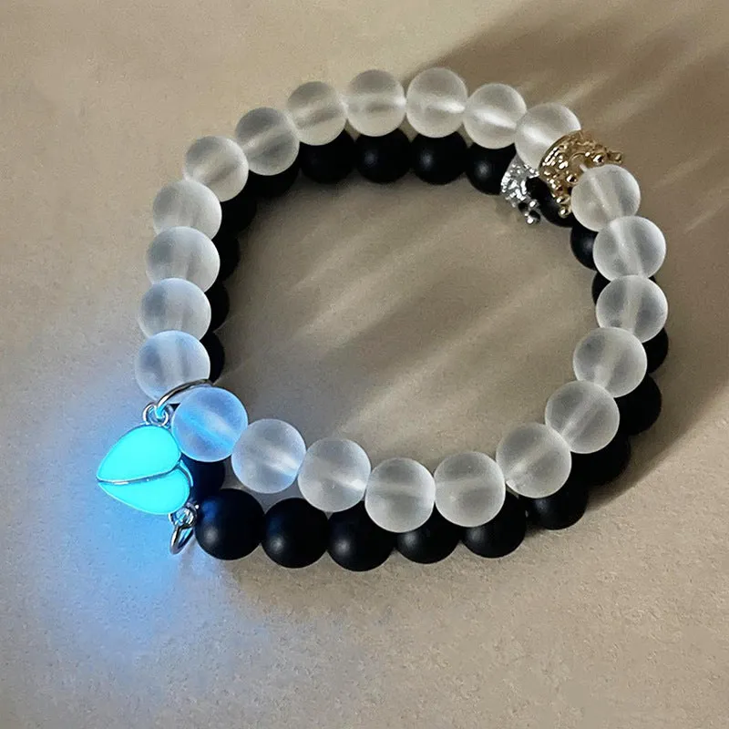 2pcs handmade glow-in-the-dark crown beaded bracelets in white and black with glass beads and luminous heart charm