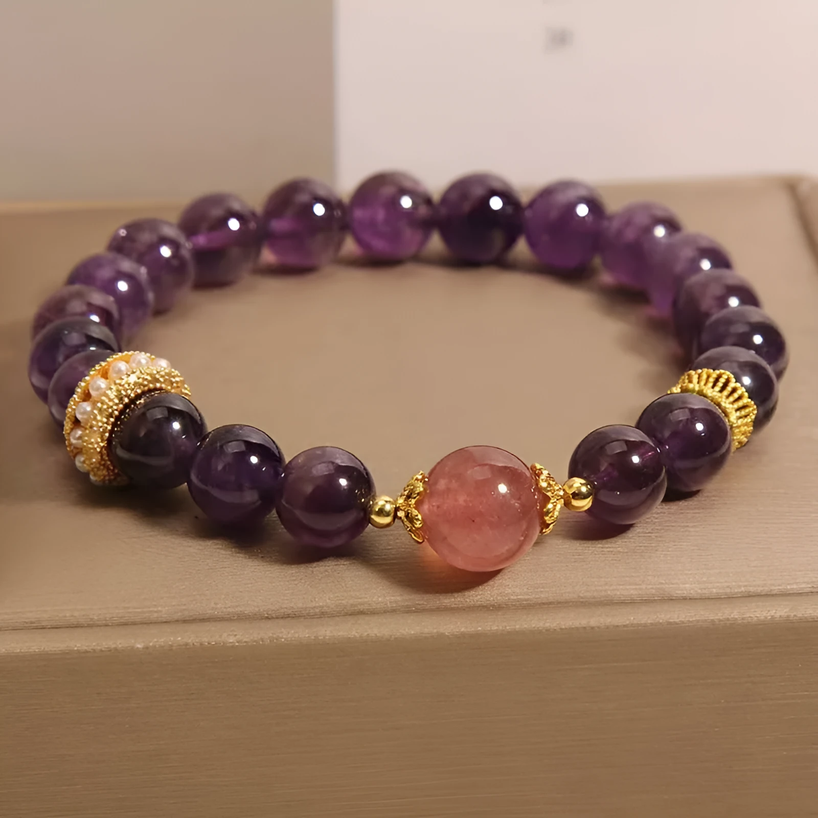 Women's natural amethyst and strawberry quartz bracelet with geometric garland design