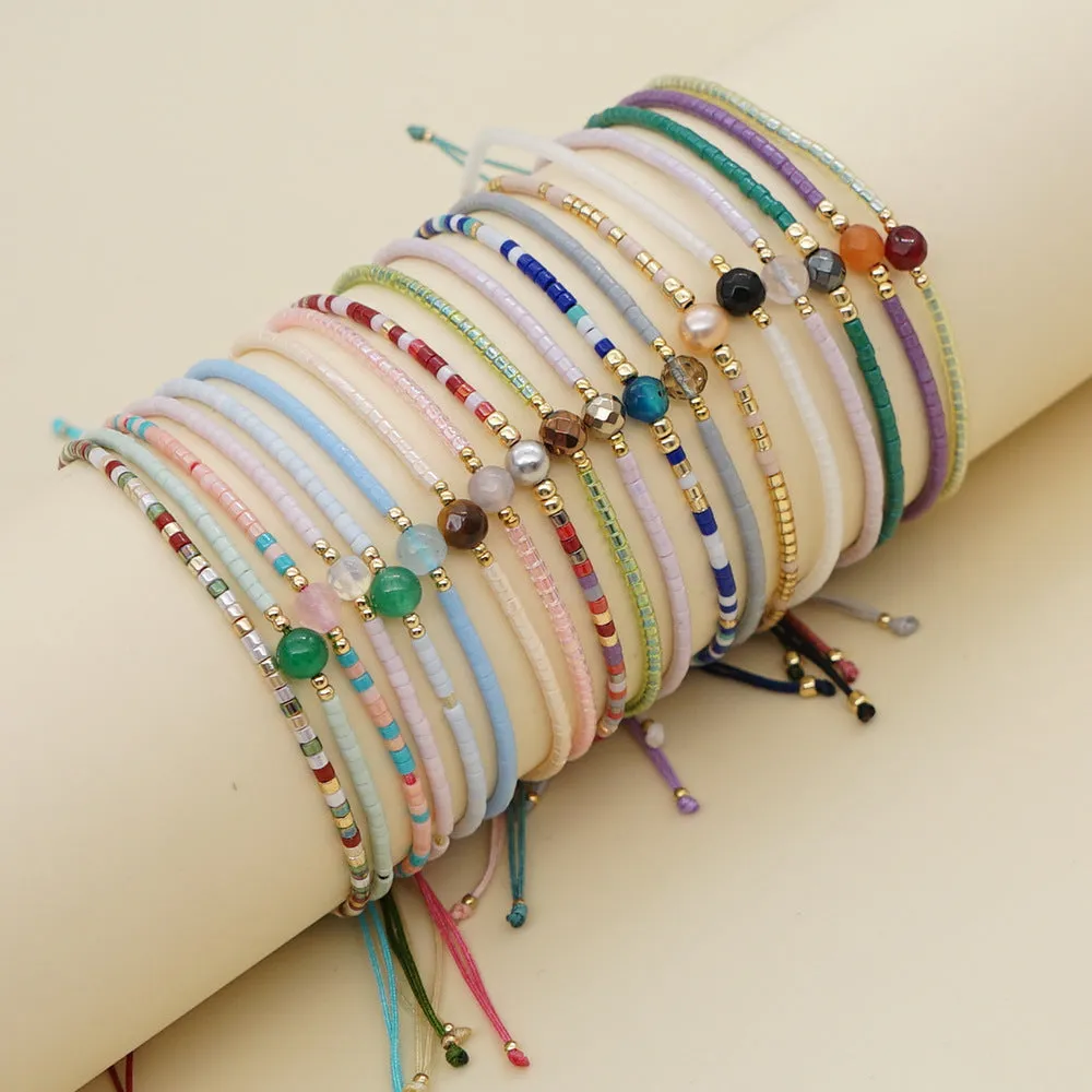 Handmade colourful beaded bracelet with geometric glass and glaze beads in bohemian style