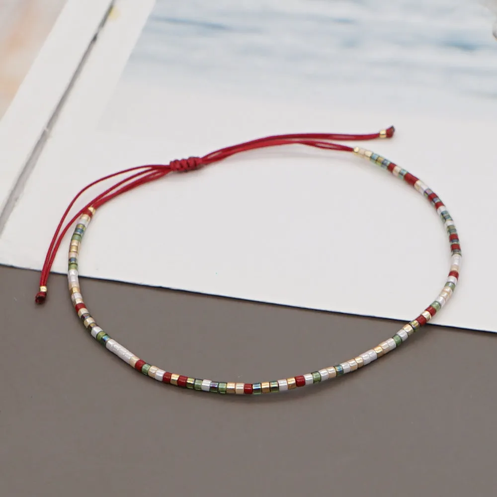Handmade colourful beaded bracelet with geometric glass and glaze beads in bohemian style