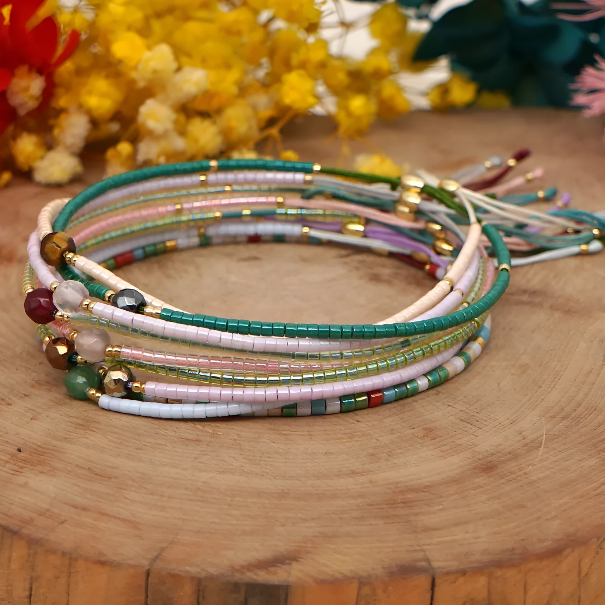 Handmade colourful beaded bracelet with geometric glass and glaze beads in bohemian style