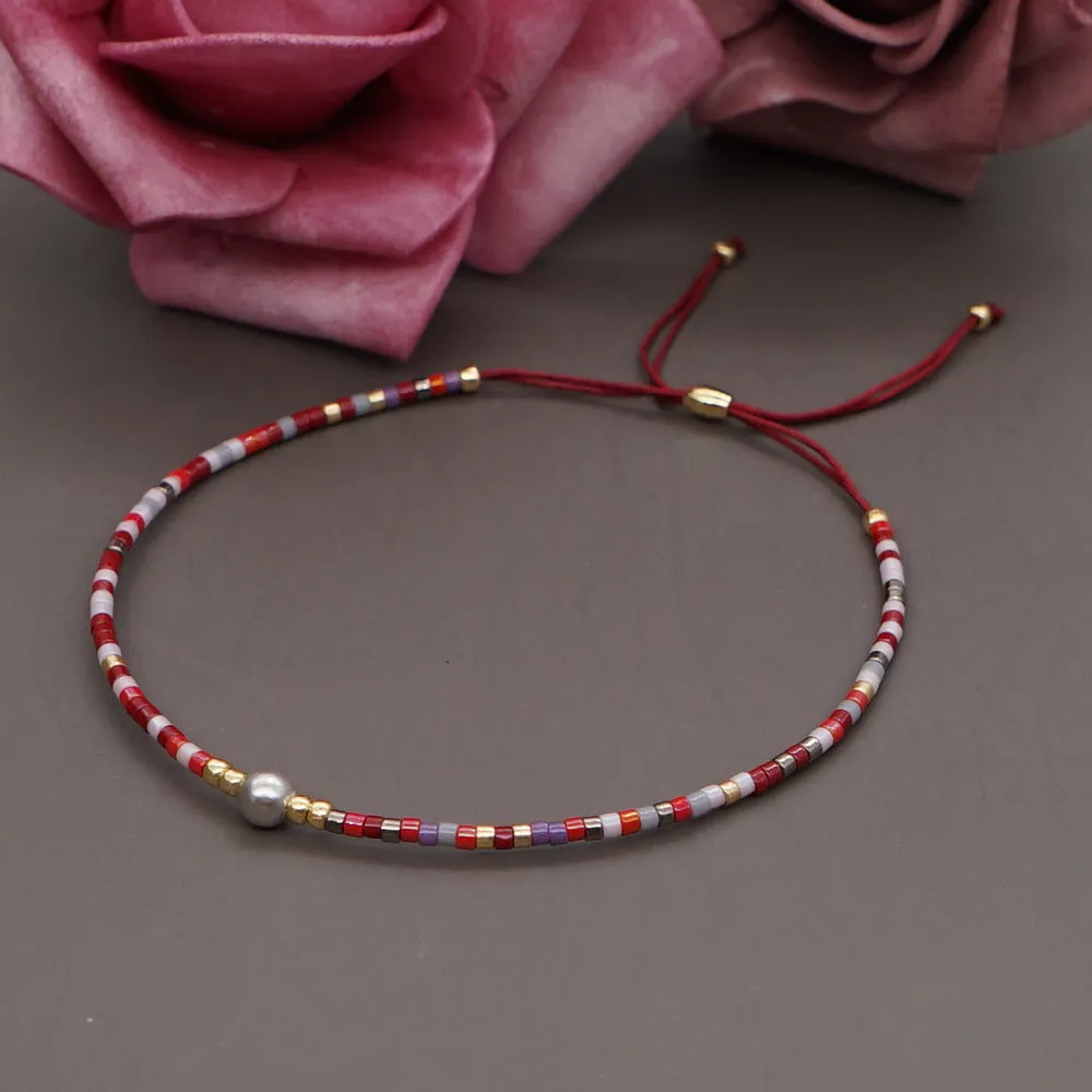 Handmade colourful beaded bracelet with geometric glass and glaze beads in bohemian style