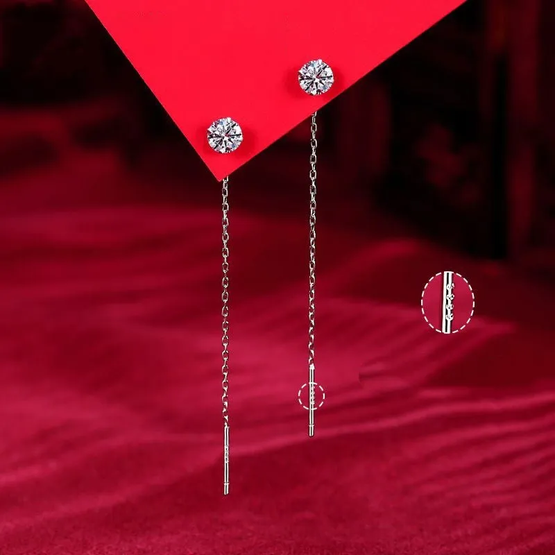 Round zirconium stud earrings with tassel rhinestone hanging in white gold colour on a geometric silver base