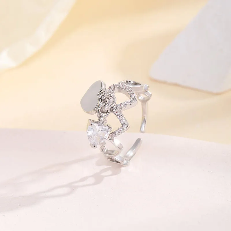 Silver electroplated copper adjustable heart ring for women on white background