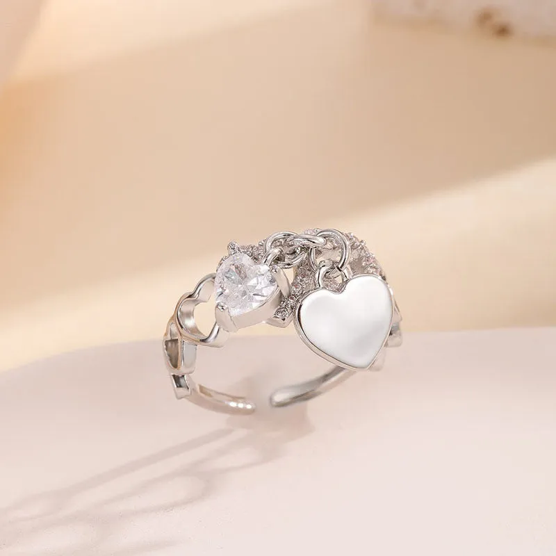 Silver electroplated copper adjustable heart ring for women on white background