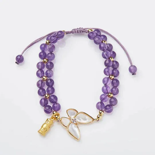 Handmade purple amethyst crystal bracelet with multi-treasure natural stone beads on white background