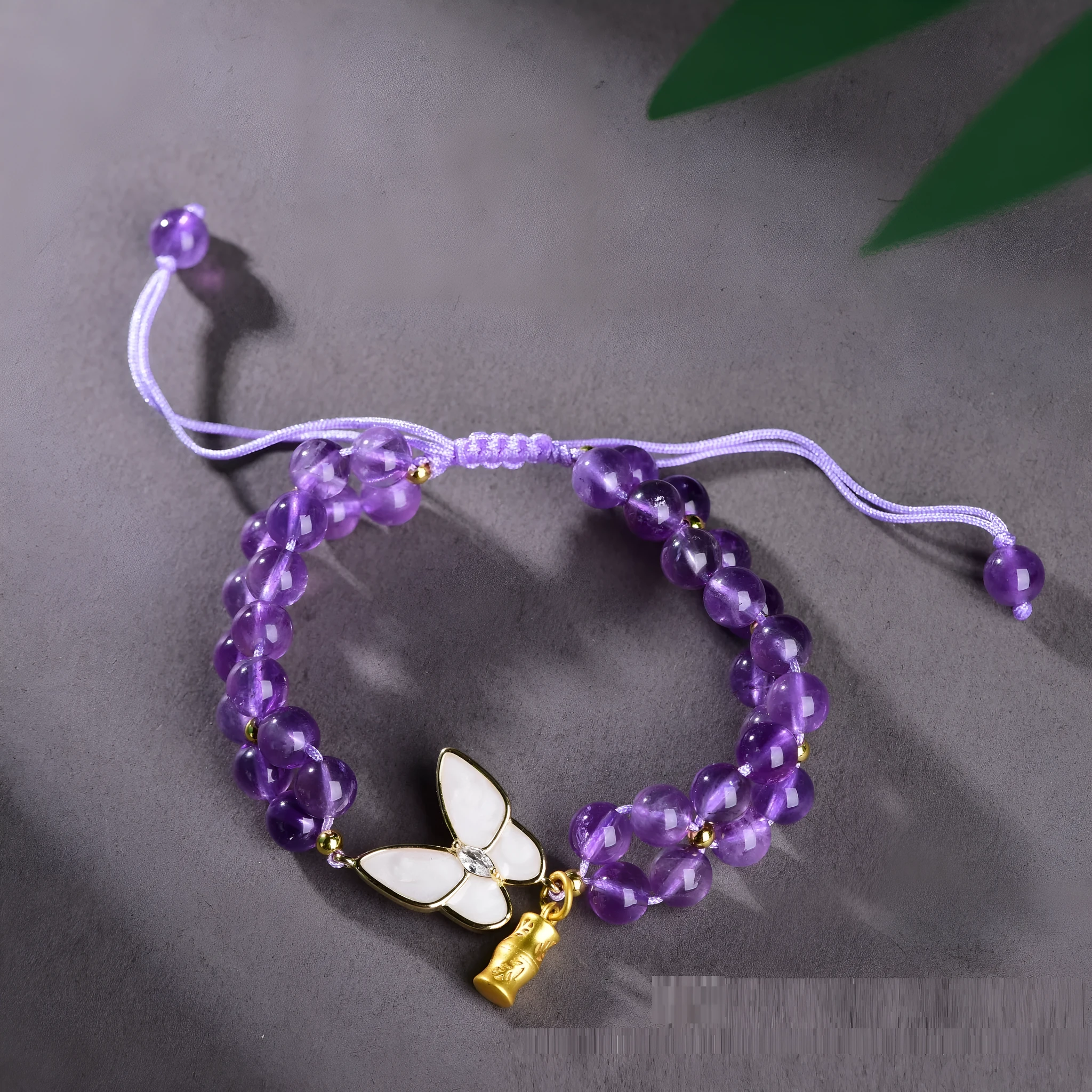 Handmade purple amethyst crystal bracelet with multi-treasure natural stone beads on white background