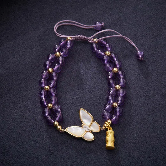 Handmade purple amethyst crystal bracelet with multi-treasure natural stone beads on white background