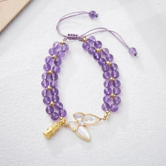 Handmade purple amethyst crystal bracelet with multi-treasure natural stone beads on white background