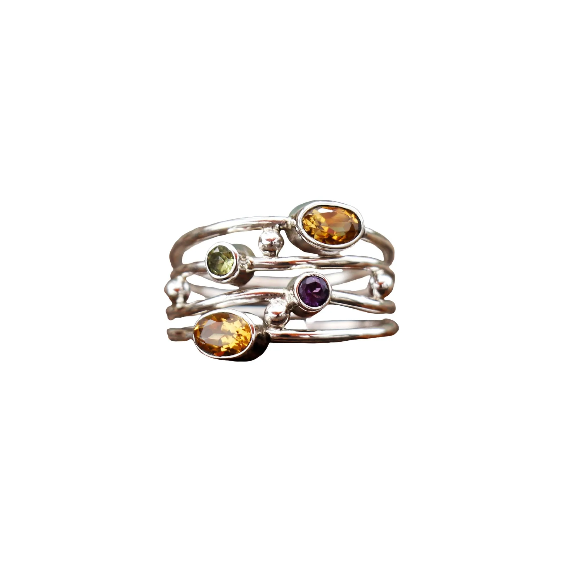 Silver bohemian diamond studded hollow copper ring with geometric ellipse shape on plain background