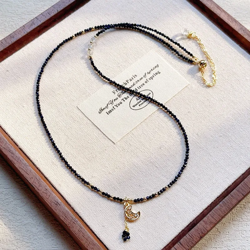 Close-up of a blue gold sand stone bracelet with three interlocking rings on a wrist.