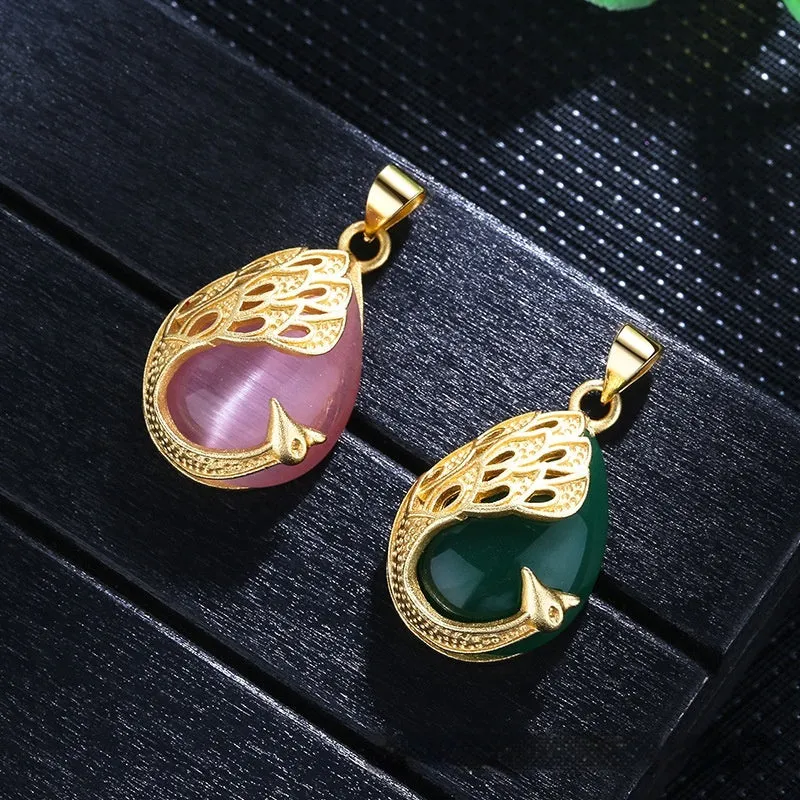 Green chalcedony imitation crystal peacock pendant on copper electroplated frame, single pendant style without chain, simple fu character design